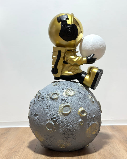 man moon sitting gold